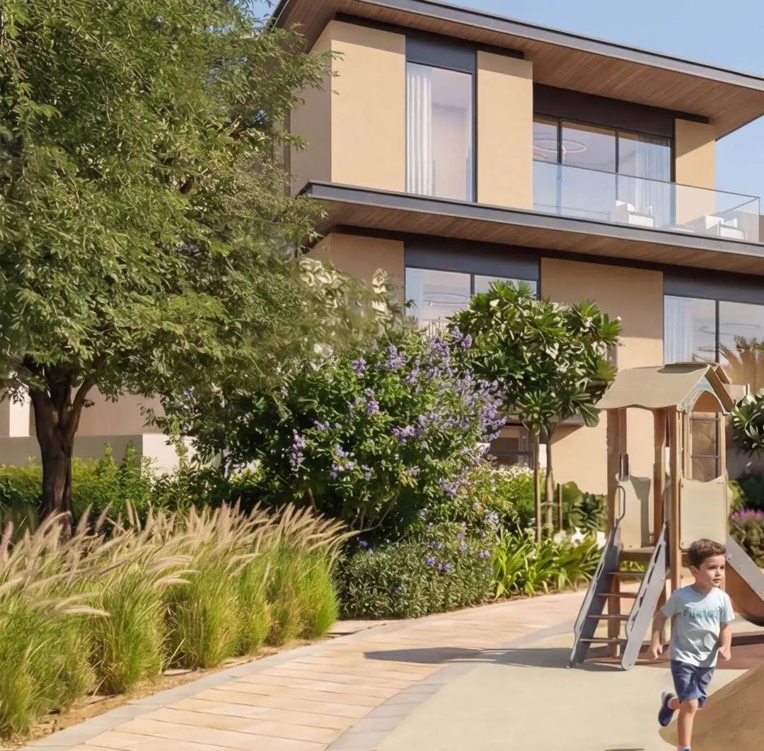 The Terraces Garden Villas at Sobha City Abu Dhabi — child playing on a landscaped community pathway between garden villas. Artist's impression. Indicative only.